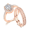 Macro view of rose gold bridal ring set with oval-cut stone and pavé diamond detail - 4 / Three-Piece Set / Rose Gold