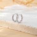 Detailed view of silver hoop earrings on a stone tray with minimalist soft aesthetic - Inner Diameter 8mm / Rose Gold