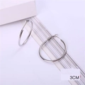 Classic silver-tone metal hoop earrings with a 3cm diameter and high-polish finish - 30MM Silver Post