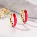 Detail of red resin and gold metal hoop earrings with a secure hinged closure - Red