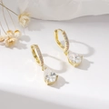 Macro detail of gold earrings featuring large pear-shaped cubic zirconia and claw setting - Gold Small Water Drop