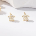 Gold star stud earrings with pave zircon stones on a white stone background - Gold White Rhinestone Floral Style
