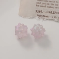 Close-up of pink translucent iridescent sea urchin acrylic beads for DIY jewelry making - Matte Purple