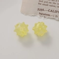 Macro shot of two yellow matte acrylic urchin beads for DIY jewelry making and crafts - Matte Yellow