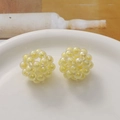 Detail of two pale yellow handmade acrylic beaded hollow balls with pearl-like finish - 1 Piece / Yellow