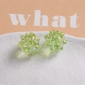Macro detail of iridescent light green sea urchin beads for DIY jewelry making - Iridescent Green