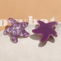 Macro shot of purple resin starfish charms with glitter finish and textured wavy surface - Purple One (B53-4-14-19)
