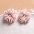 Detailed view of handmade pink beaded flower charms for jewelry making and hair accessories - Pink