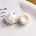 Detail view of white resin sea urchin star charm accessories for DIY jewelry making - White