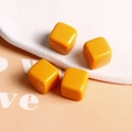 Macro view of 14mm bright orange macaron square resin beads for DIY earring crafts - Bright Yellow