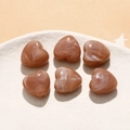 Macro shot of heart-shaped acrylic beads with dark marble texture for DIY jewelry making - 1 Piece / Tan