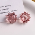Macro shot of pink translucent resin sea urchin ball beads on white ceramic tray - Light Pink