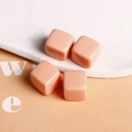 Macro shot of 14mm nude peach square resin beads with rounded edges for DIY jewelry making - Light Pink