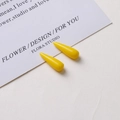 Macro shot of glossy bright yellow teardrop resin charms for DIY earring making - Light Yellow