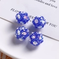 Close-up of blue glass beads and flower sequins on handmade flower ball jewelry charms - Dark Blue