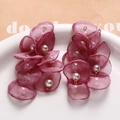 Detail of burgundy mesh petal drop earrings with pearls and gold metal links - Fuschia