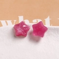 Macro shot of hot pink glitter resin star pendants for DIY earrings and phone cases - Rose Red