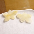 Macro detail of yellow translucent resin flower charms with radiant petal texture for DIY jewelry - Yellow