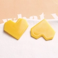 Macro view of yellow pixelated acrylic heart charms with glossy resin finish for jewelry DIY - Yellow Heart Shaped