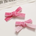 Close-up of pink velvet ribbon hair clips with elegant double-layered bow design - Deep Pink
