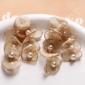 Detailed view of handmade mesh flower petals with pearls for DIY jewelry accessories - Tan