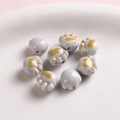 Handmade ceramic cat paw beads in gray and yellow for DIY jewelry making and crafts - Gray