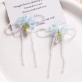 Detail of handcrafted blue and white beaded bow accessories with long hanging tassels - Blue Bow Flower (A11-7-10)