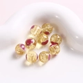 Detailansicht von 10 mm gelben Glasperlen mit rotem Herzmuster und Goldfolie - Hellgelbe Herz-Rundperle (25#) / 1 Stück / Hellgelb