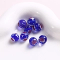 Makroaufnahme von 10mm dunkelblauen Lampwork-Glasperlen mit lila Spiralmustern - Dunkelblaue Herz-Rundperle (19#) / 1 Stück / Dunkelblau