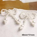 Dettaglio macro del fiocco in perle bianche 48x51mm per la creazione di gioielli fai da te - Stile Fiocco con Perla Pendente (12#)