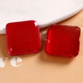 Macro view of square red resin patches with golden glitter texture for DIY jewelry - Red Round