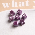 Close-up of 9mm purple glazed ceramic cube beads with central hole for DIY jewelry - 1 Piece / Purple
