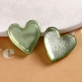 Macro view of two light green heart resin charms with silver foil texture detail - Light Green Heart