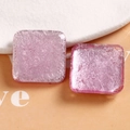 Macro shot of 30mm square resin charms with glossy silver foil and pearlescent glitter texture - Pink Square