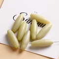 Close-up of oval lemon jade beads with natural stone texture for DIY jewelry making - Lemon Jade