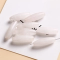 Detailed view of polished white translucent oval spindle beads for DIY jewelry making - Rose Quartz