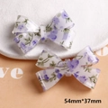 54mm x 37mm bow accessory featuring purple floral patterns on white resin base - Purple Bow