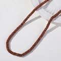 Macro detail of 6mm flat round brown goldstone beads for DIY jewelry making - 1 Piece / Gold Sandstone