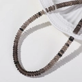 Macro detail of 6mm smoky quartz flat beads and black spacers for jewelry making - 1 Piece / Smoky Quartz