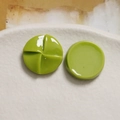 Macro shot of 20mm grass green resin round windmill charms for DIY phone case decor - Fruit Green