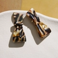 Luxurious acetate tortoiseshell bow hair clips in amber and brown tones for women - Brown