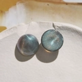 Macro detail of 18mm starry blue iridescent acrylic cabochons with sparkling glitter - 1 Piece / Gray