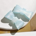 Set of two light blue bow hair clips with pearlescent marble texture for women - Blue