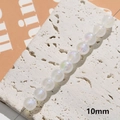 String of 10mm iridescent white acrylic faux pearls with a luminous pearlescent finish - 10mm (1 Piece)