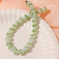 Detail of 13mm light green glass beads with plant patterns for DIY jewelry making - 1 Piece / Green