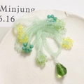 Handmade light green beaded accessory featuring yellow floral accents and a teardrop pendant - Green