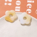 Detailed close-up of marbled resin five-petal flower DIY accessories on a white plate - Light Yellow (75#)