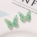 Close-up of translucent green acetate butterfly charm with dark leopard spots - Green Spotted Style (B03-3-14-28) / Green
