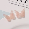 Close-up of pink translucent butterfly resin charms with subtle glitter and polka dots - Pink Polka Dot Style (B03-3-14-28)