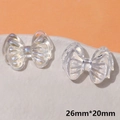 Makroaufnahme von Harz-Schleifenanhängern in irisierend und klar, Größe 26mm x 20mm - Transparente Schleife